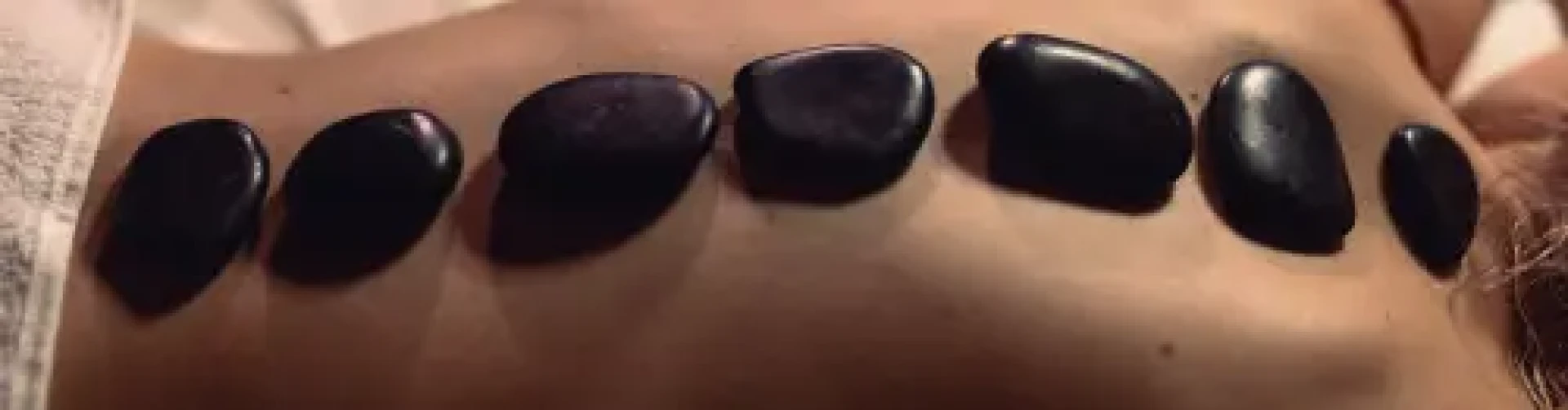 Warm up this October with a hot stone massage