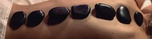 Warm up this October with a hot stone massage